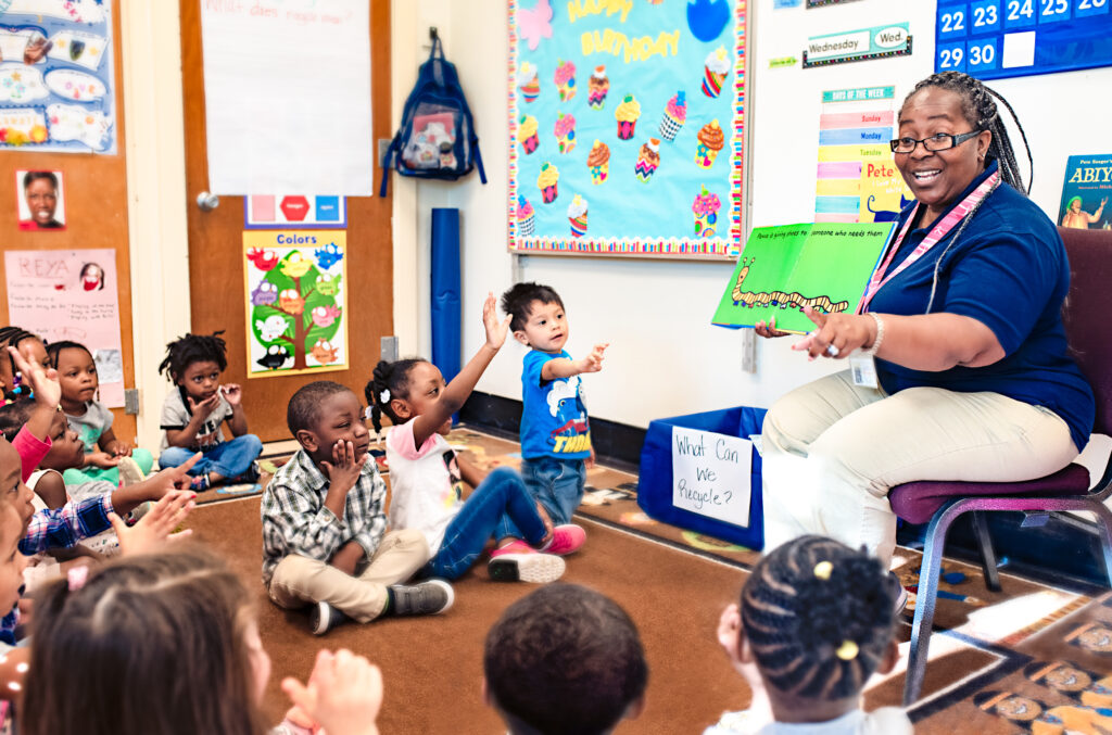 teacher leading storytime with pre-k children