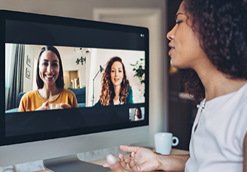 Woman video chatting on her desktop computer